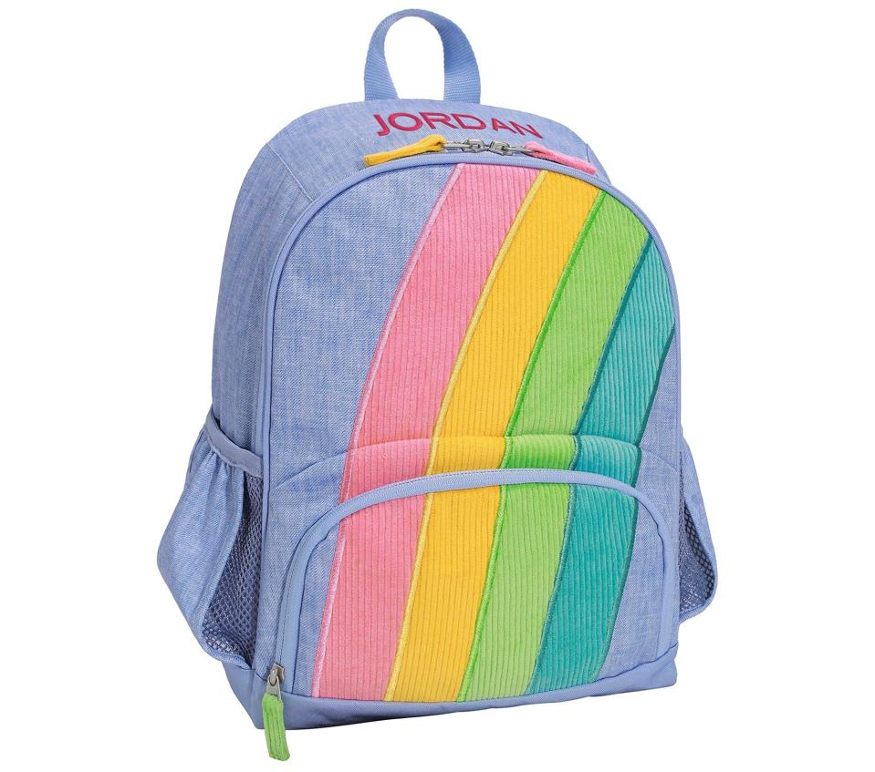 A product shot of the Mackenzie Rainbow Applique Backpack