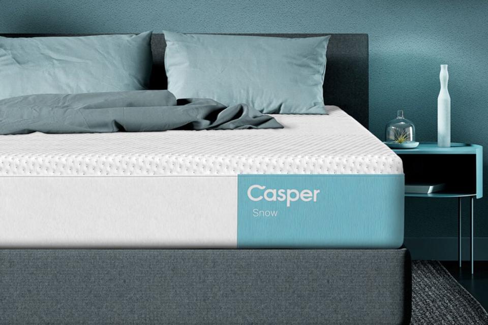 Casper Snow Mattress (Queen) in a teal room with a teal nightstand