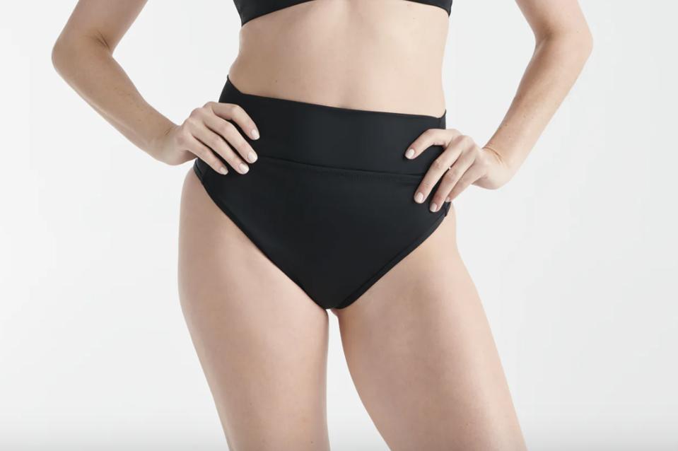 Knix Leakproof High Rise Bikini Bottoms on a female figure