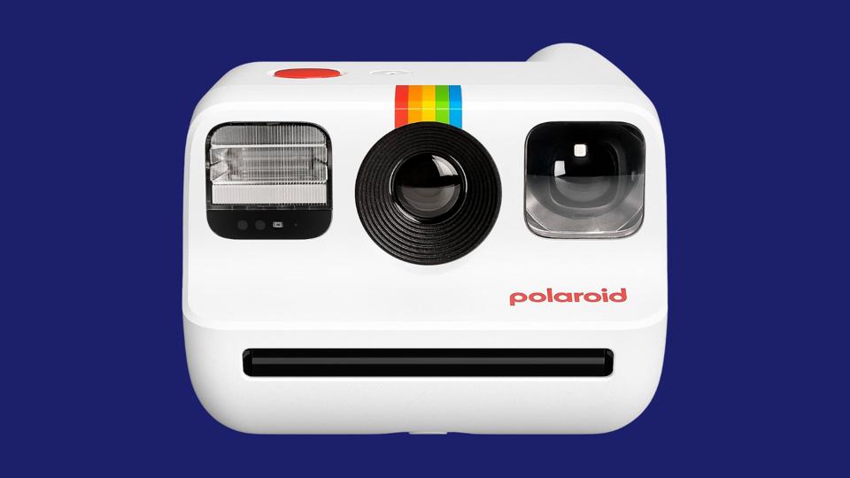 A Polaroid camera on a navy background