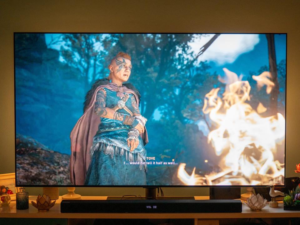 A screenshot of Assassin's Creed Valhalla displayed on a TV.