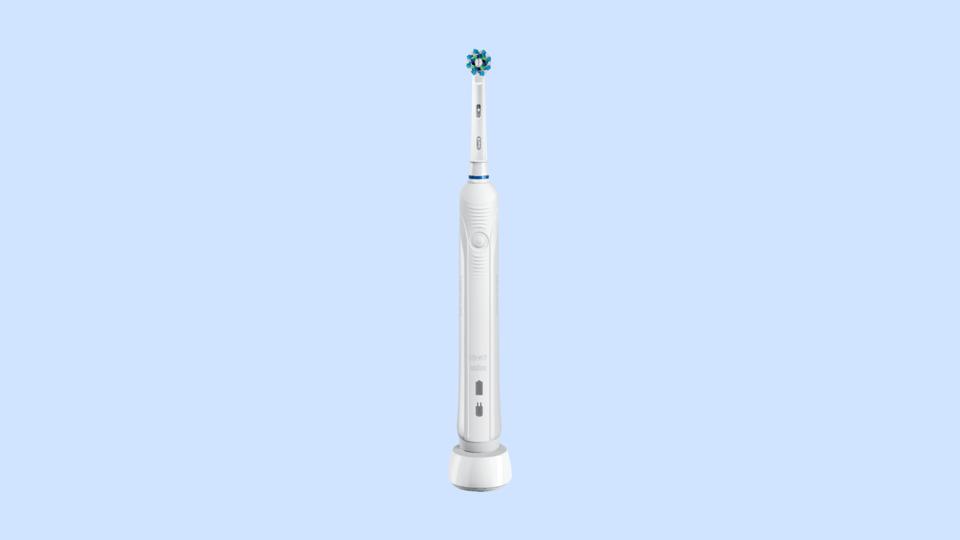 The Oral-B Pro 1000 Electric Toothbrush in white against a blue background