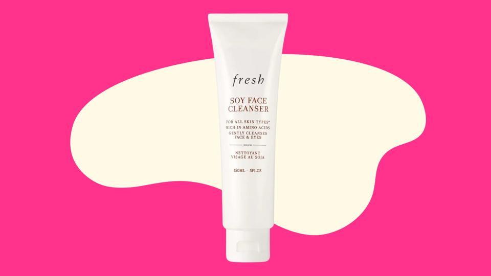 A white bottle of Fresh Soy Face Cleanser on a pink abstract background