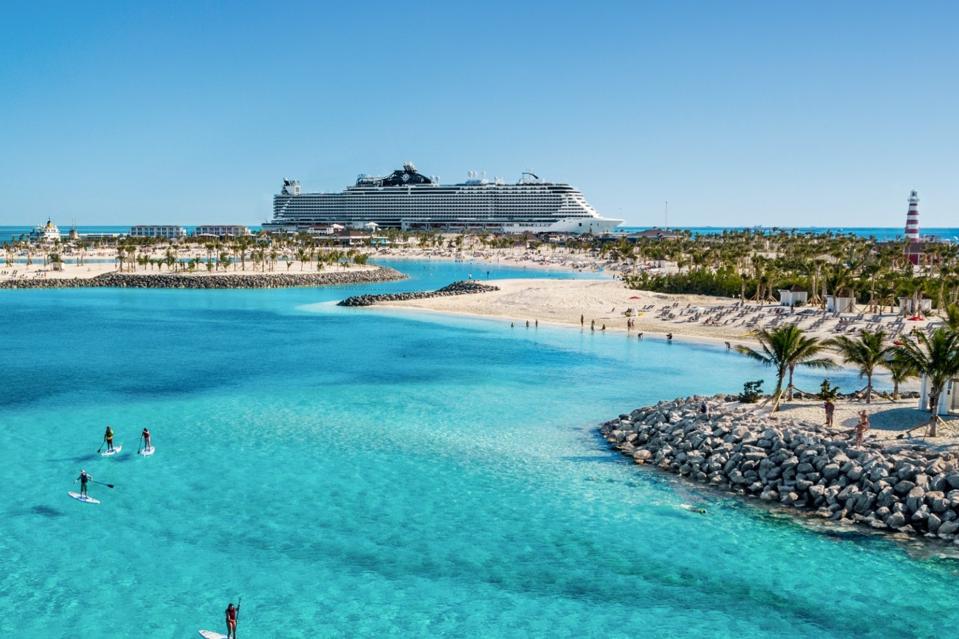 Beach scene with cruise ship in the distance