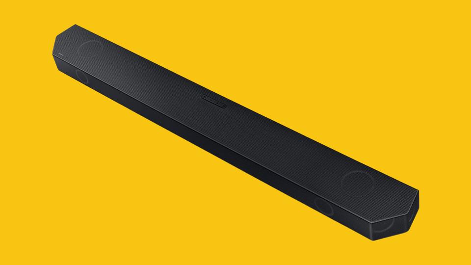 Samsung HW-Q990C 11.1.4ch Soundbar on a yellow background