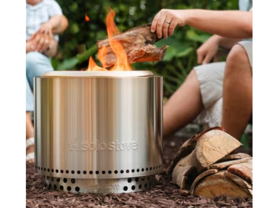  Best Father's Day Gifts: Solo Stove Bonfire Fire Pit stainless steel outside with baby in bg