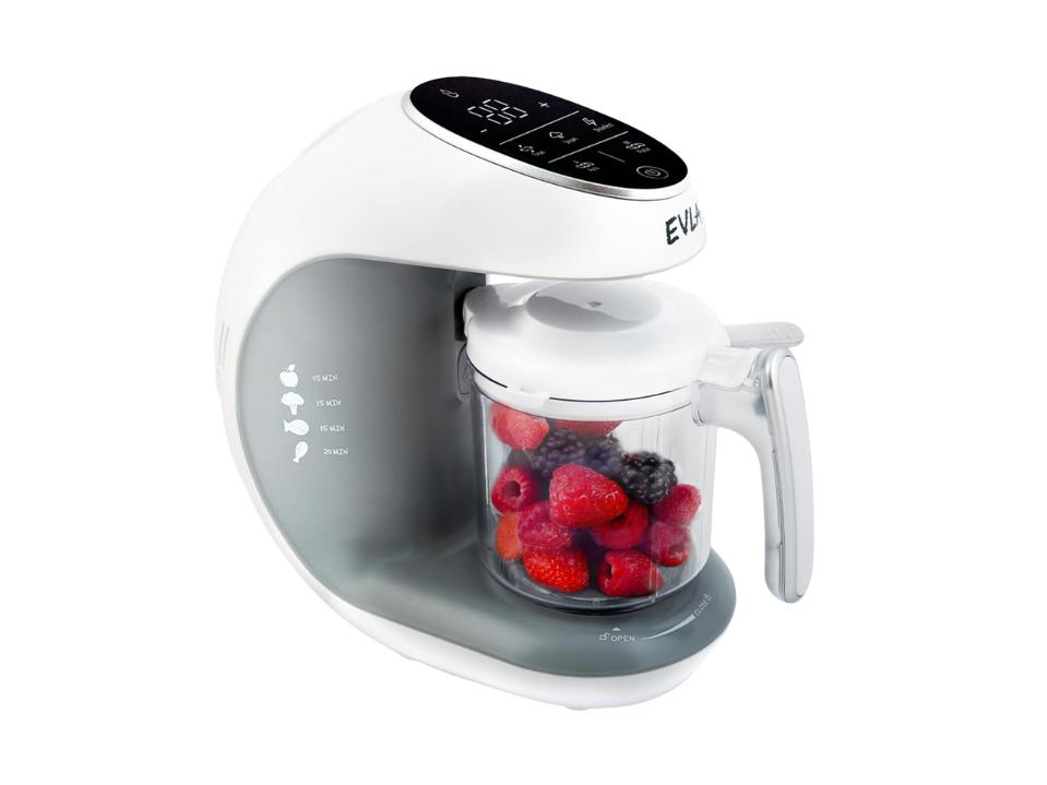 image of white EVLA'S Baby Food Maker full of red & blue berries on a white background