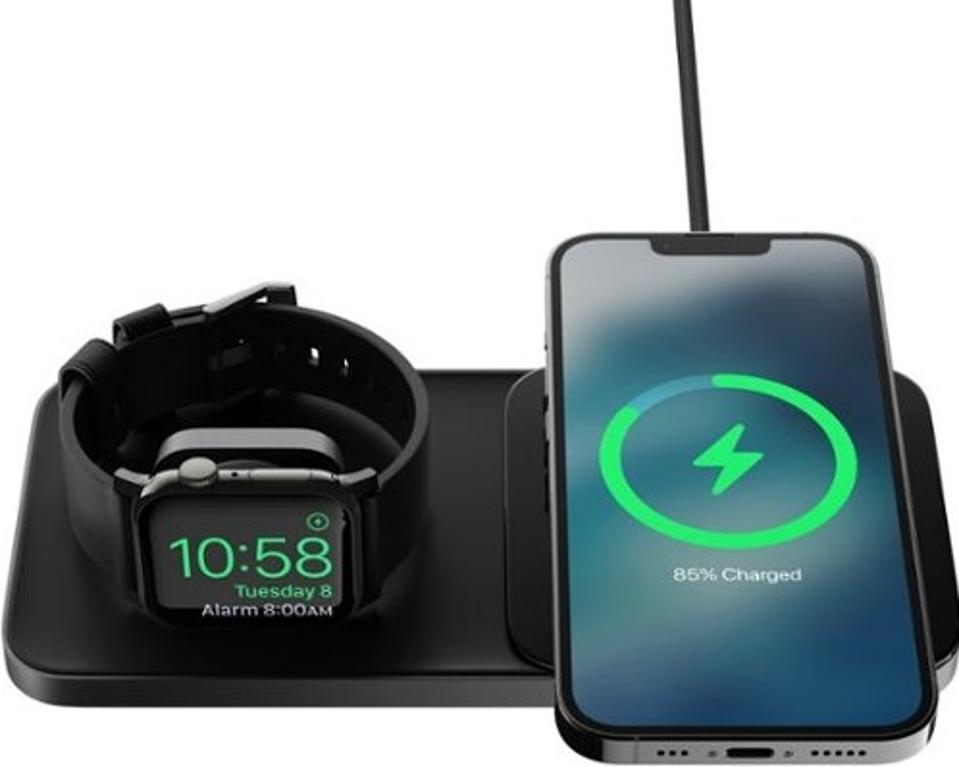 Nomad Base One Max in black with cell phone and watch charging.