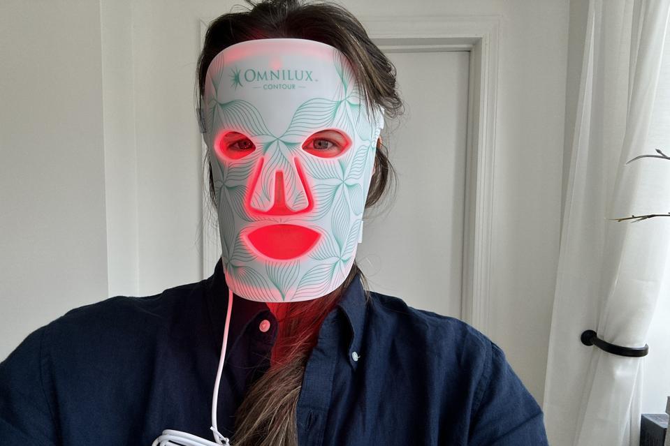 Victoria Moorhouse wearing a lit Omnilux LED Face mask