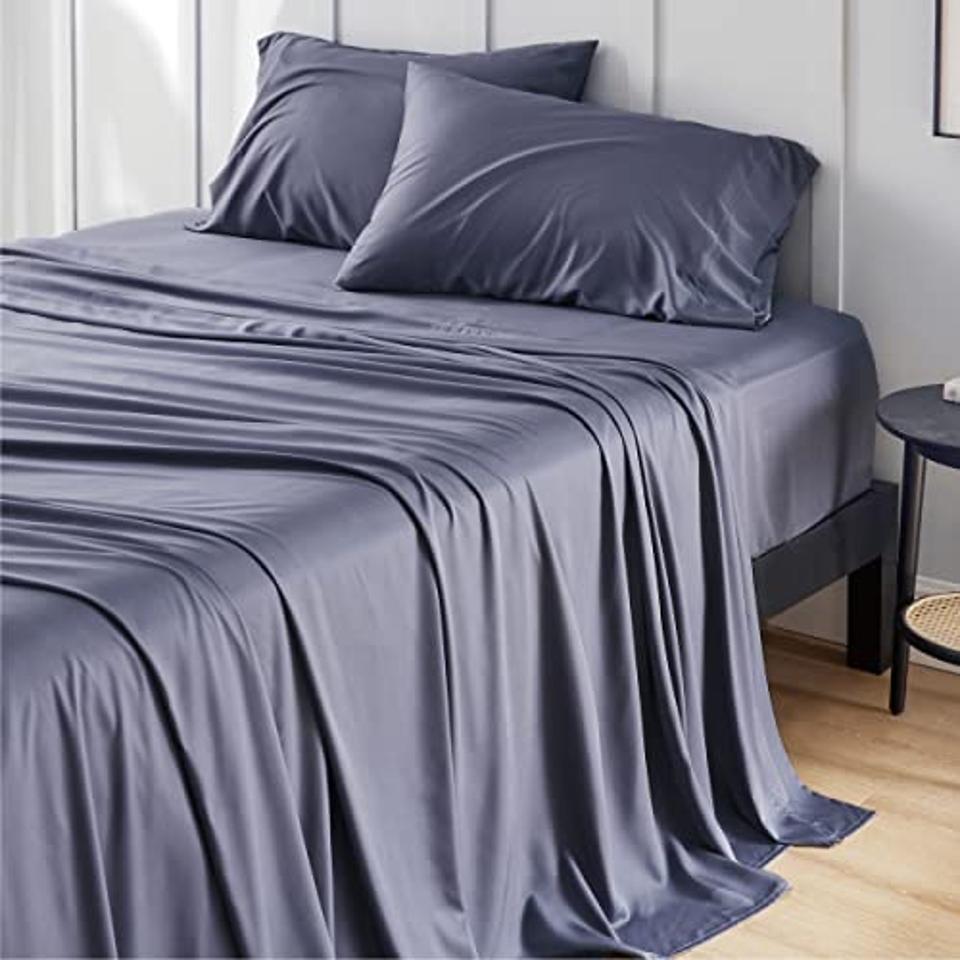 Bedsure Bamboo sheets in a gray color on a made-up bed. 