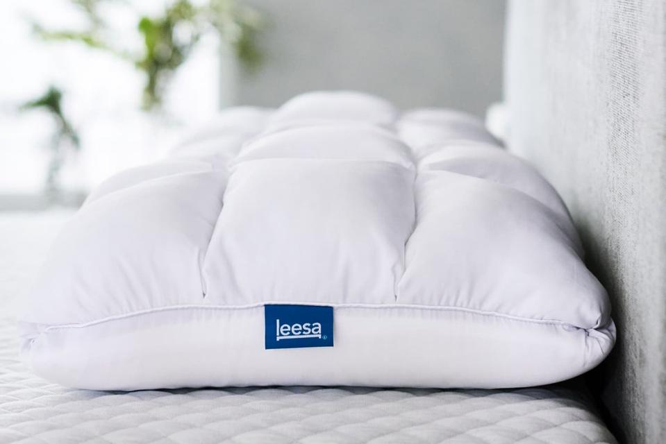 An image of the Leesa Hybrid Pillow on a mattress. 