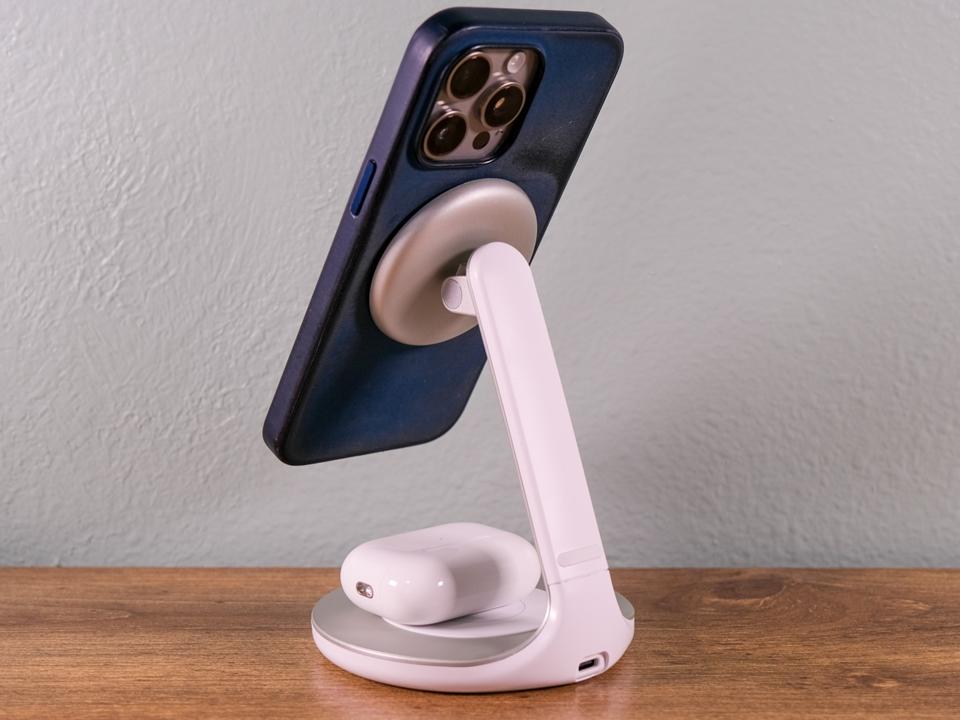 The Anker PowerWave Magnetic 2-in-1 Stand with an iPhone and Airpods charging.