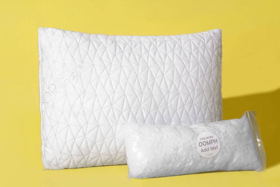 The Coop Home Goods Adjustable Loft Pillow with a yellow background.