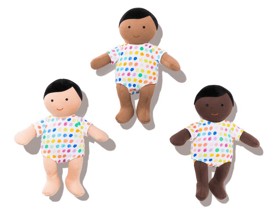 Three Lovevery Organic Baby Dolls with different skin tones.