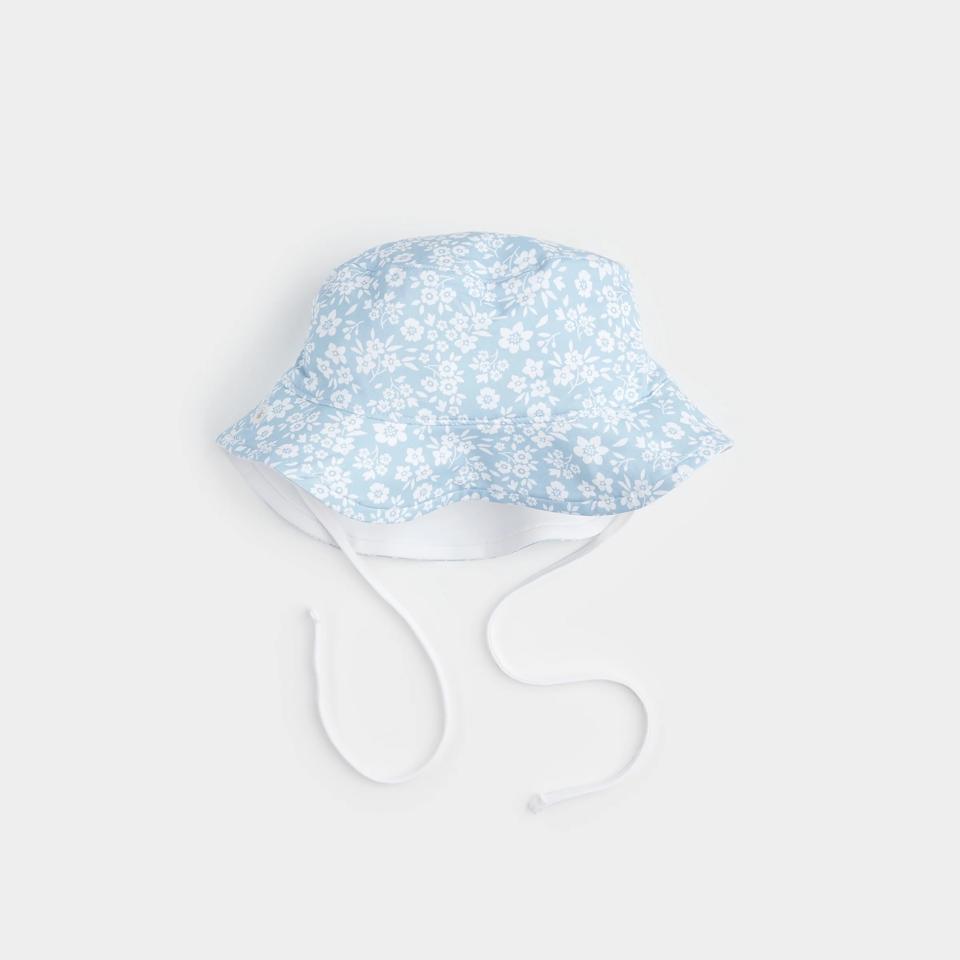 Petit Lem Reversible Sun Hat on a pale background