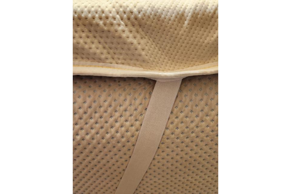 A close up of the Saatva Graphite Memory Foam Mattress Topper.