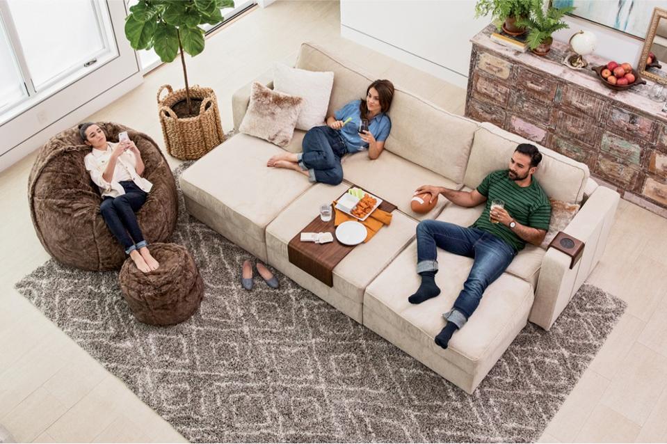 A young family lounging on the Lovesac Sactional 