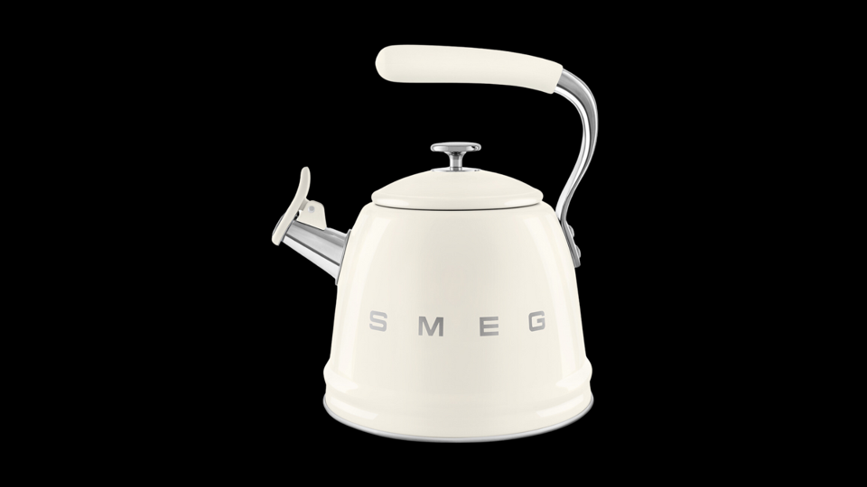 The Smeg Whistling Tea Kettle on a black background.