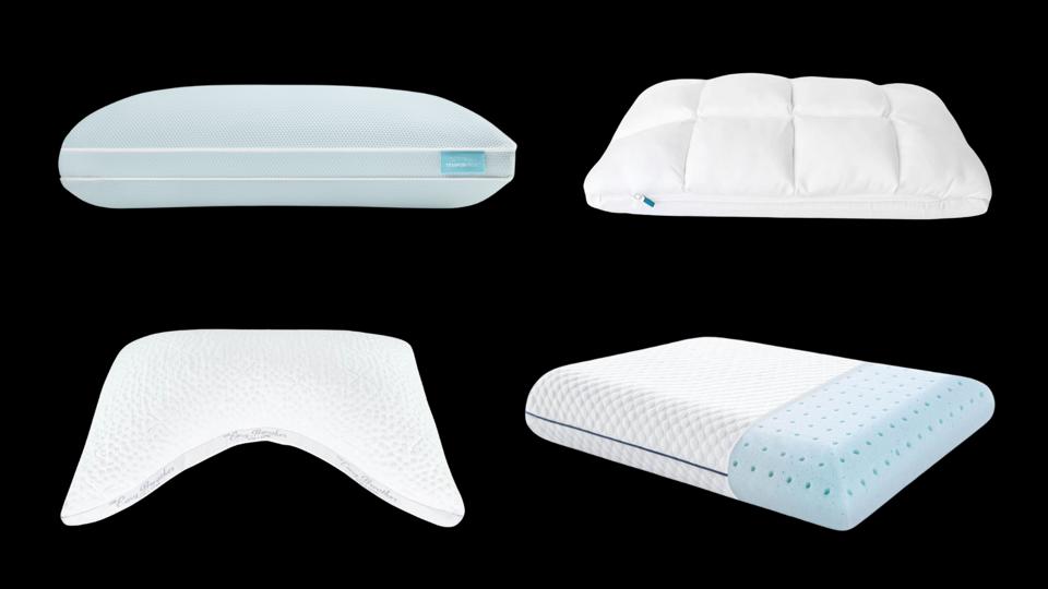 Four memory foam pillows on a black background