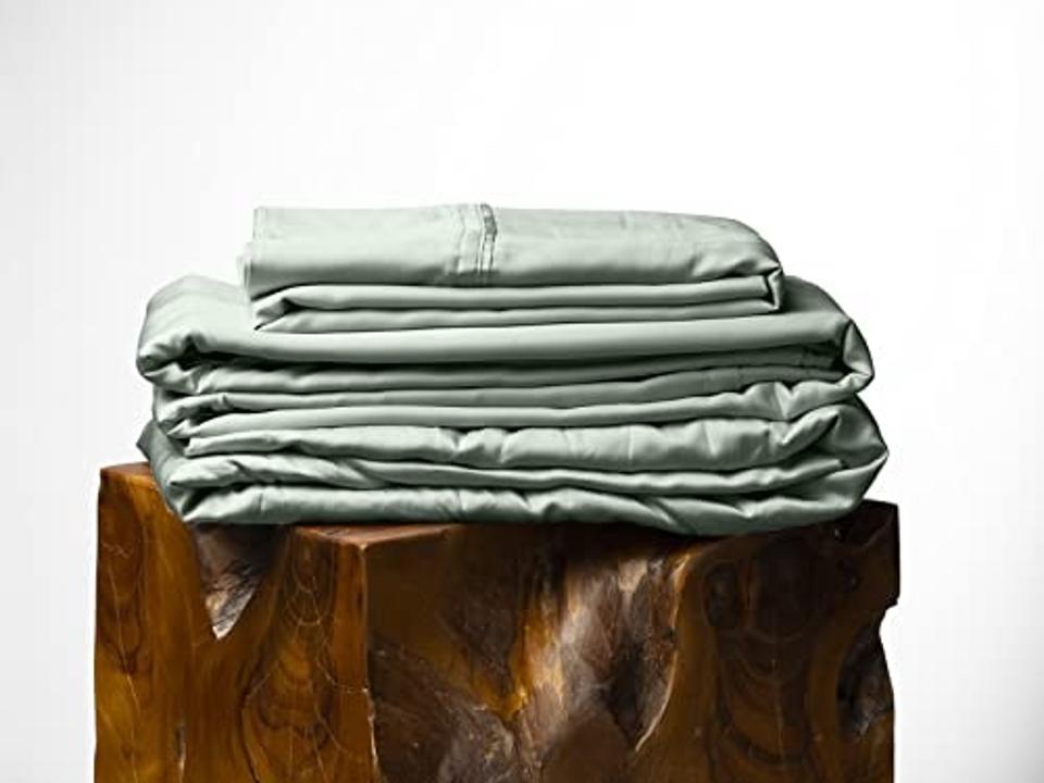 Olive + Crate Luxury Series 100% Tencel Eucalyptus Sheet Set in Spring Sage on wood.