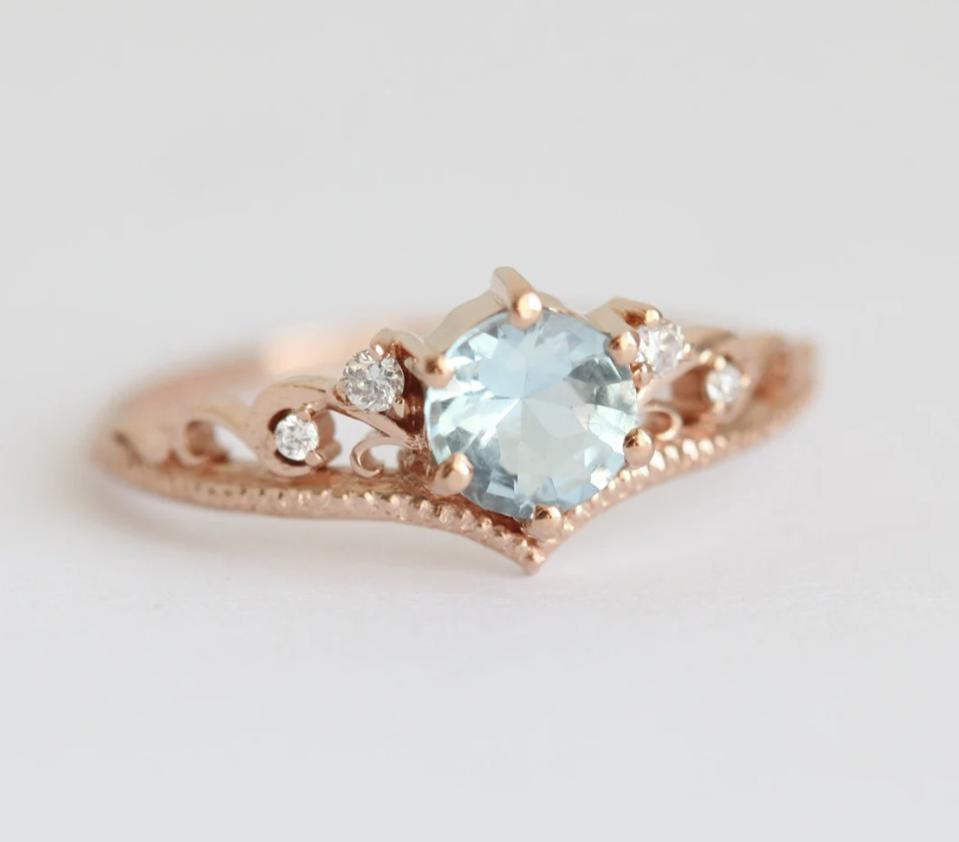 The Capucinne Bella Aquamarine Engagement Ring With Diamond Matching Band against a white background. 