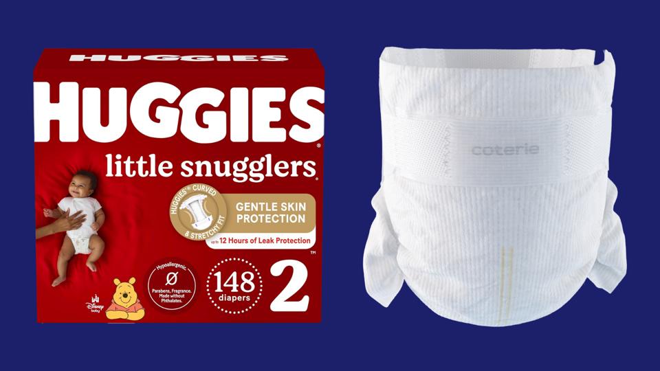 A box of Huggies Little Snugglers diapers and a Coterie Diaper on a navy blue background