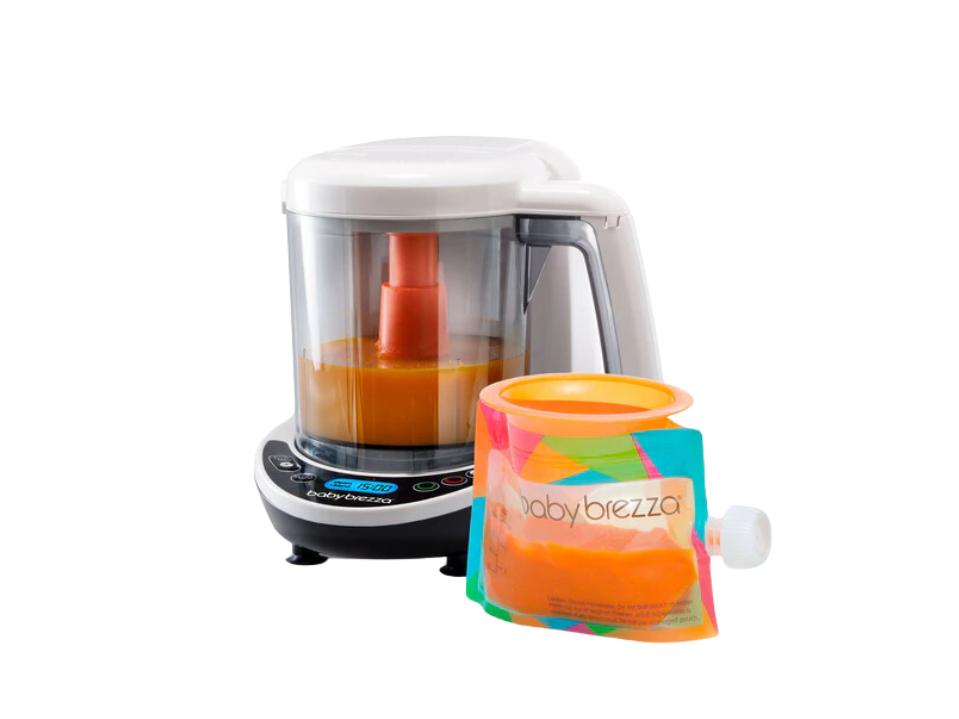 image of baby brezza One Step Baby Food Maker Deluxe & orange puree in pouch on white BG