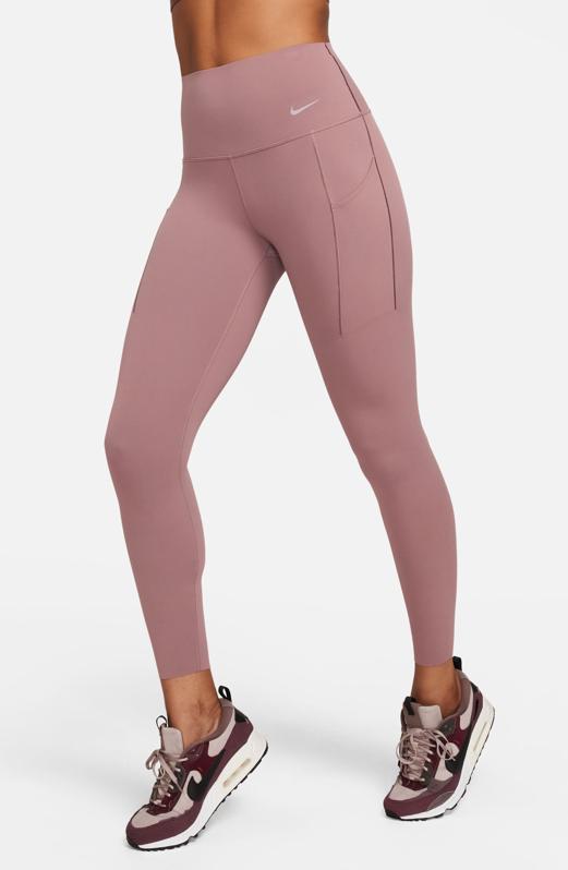 Waist-down shot of a woman wearing mauve Nike Universa Medium Support High Waist Leggings