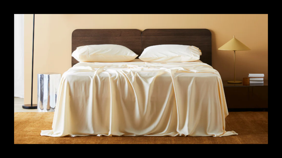 The Ettitude CleanBamboo Sheets draped over a mattress.