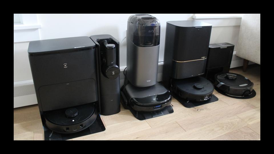 Four of the best robot mops featured in a living room. 