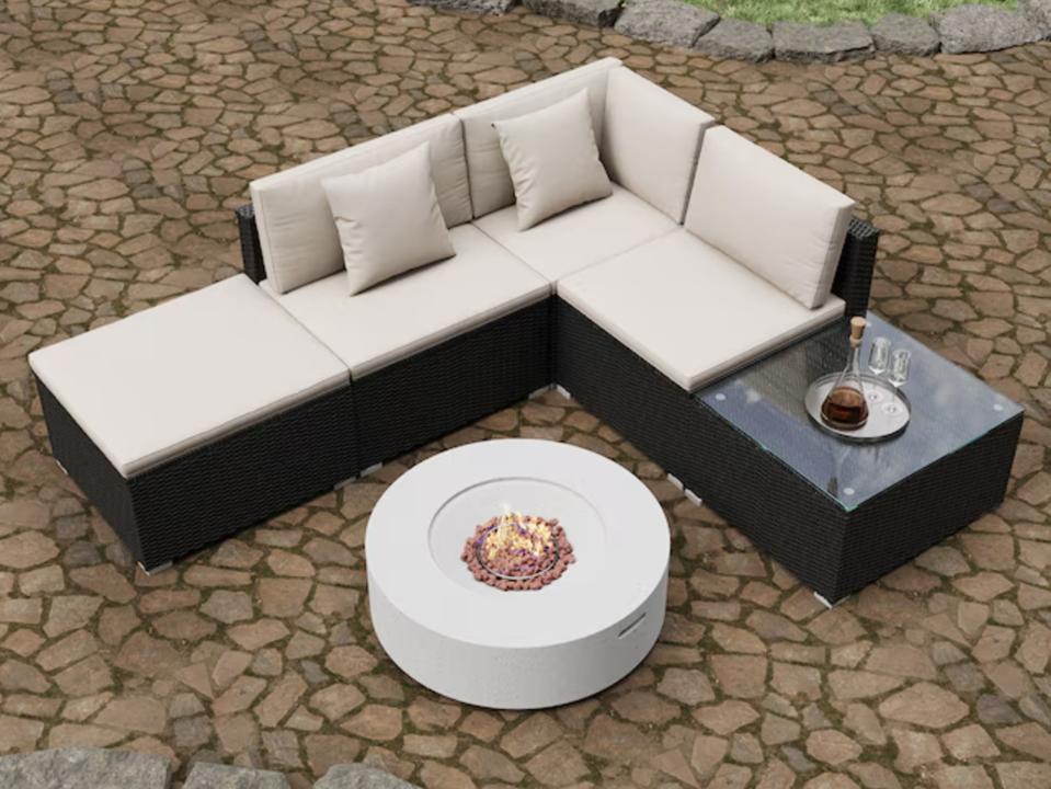 Mondawe Wicker 5-Piece Conversation Set on a stone patio