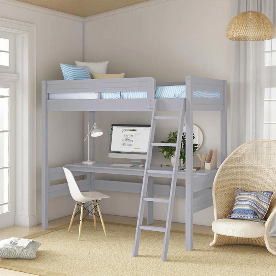 Isabelle & Max Everiz Kids Twin Loft Bed in a decorated room with a desk under it. 