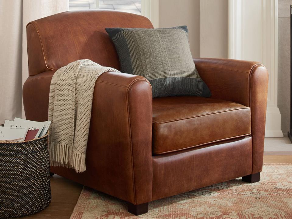 Lifestyle image of the Rejuvenation Doyle Leather Club Chair in a living room.