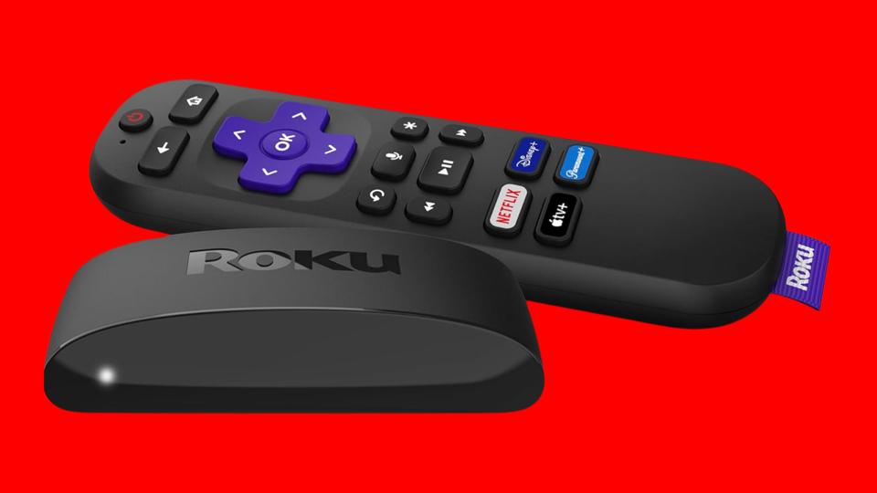 A Roku streaming device on a red background