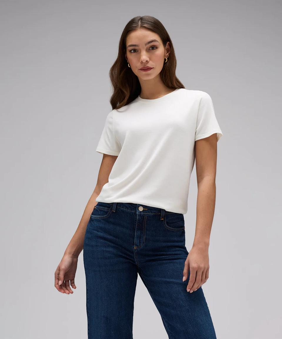 Woman wearing Unbound Merino Women's Crew Neck T‑Shirt in Ivory