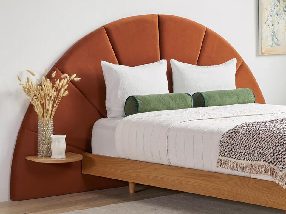 A bed against a red Almelo Headboard from Article 