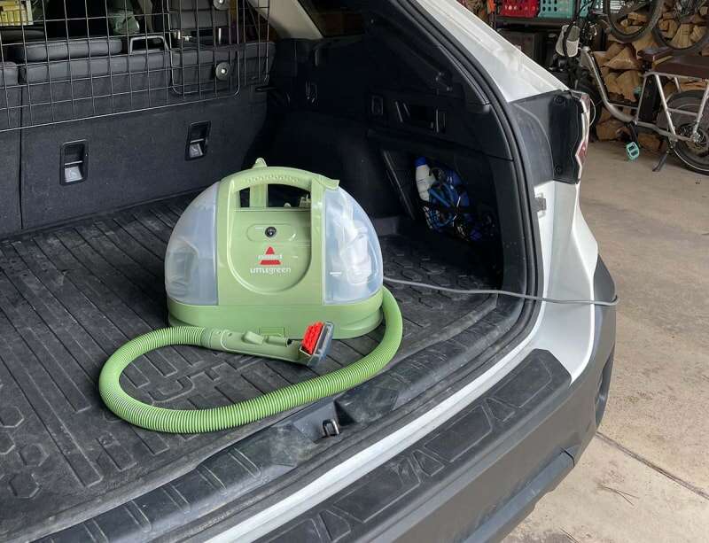 Bissell Little Green in the back of an SUV