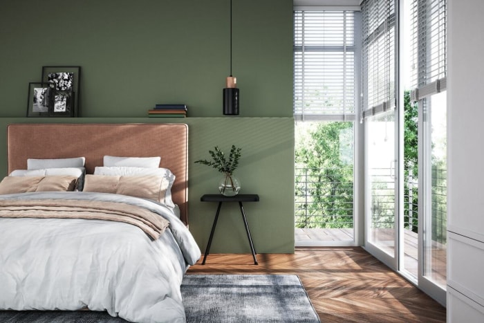 Une chambre moderne avec des murs peints en vert.